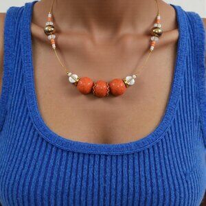 Tropical vibes. Simple orange Bead floating choker with crystal and gold accents